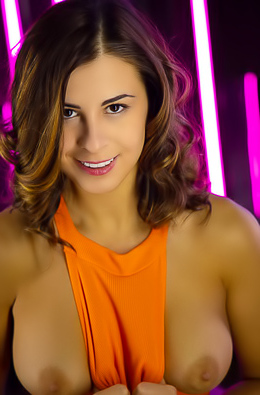 Alice Kelly Voluptuous Beauty Tugs At Her Vibrant Orange Bodysuit