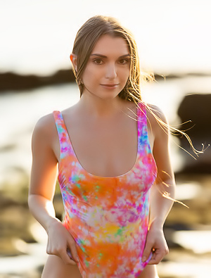 Monika May With Sensual Curves Against The Rugged Landscape