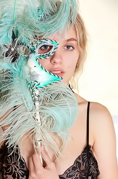 Mila Amour Makes Flirtatious Eye Contact Through An Ornate Venetian Mask