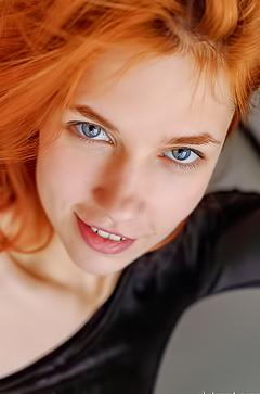 Redhead Ariel Teases On The Green Sofa With Spread Pussy